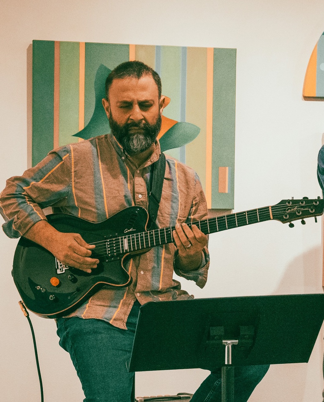 Rahib playing guitar